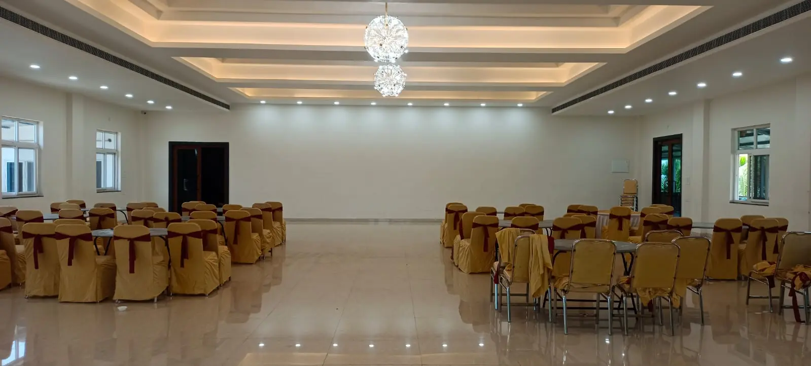 Spacious indoor conference and banquet hall interior at ALOHA Shamshabad