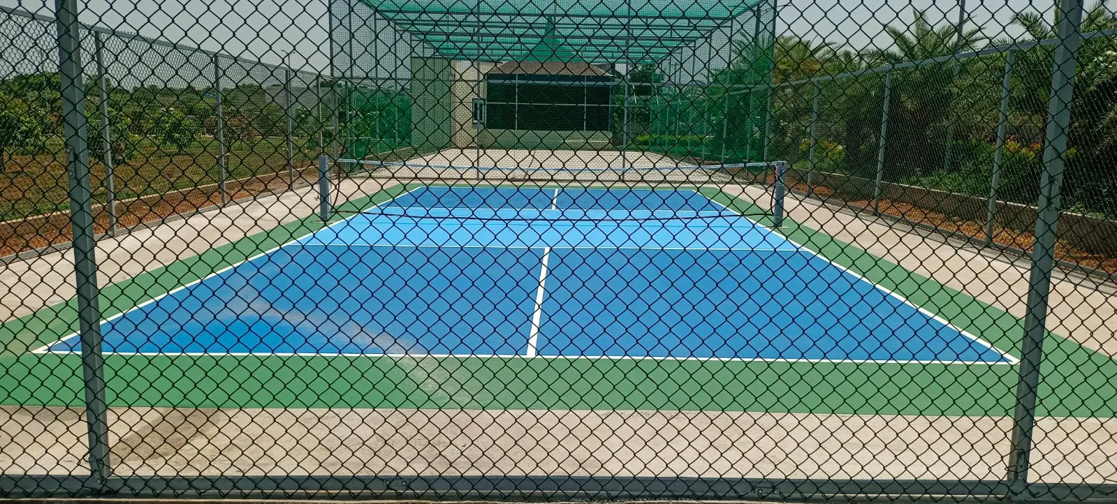 Multi-sport court (badminton, tennis, pickleball) for family activities at ALOHA Shamshabad