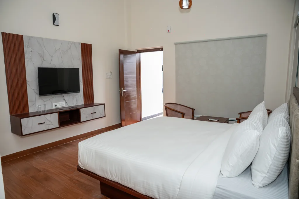 ALOHA Resorts — pool-facing villa room interior with modern amenities